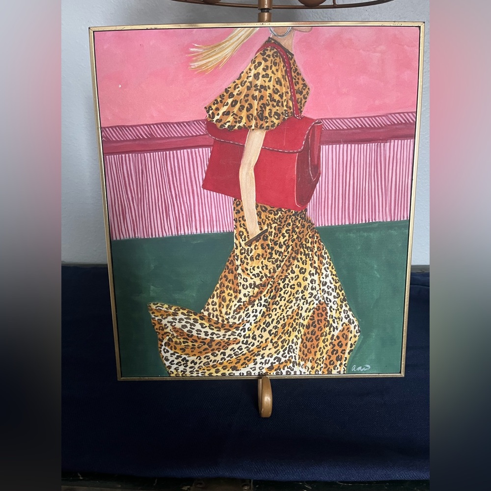 Hobby Lobby picture. Woman with red bag and cheetah print dress.